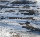 Salt, Ice Melt & Your Lawn: How to Protect Turf Along Driveways and Walkways